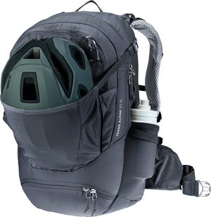 Deuter Trans Alpine 22 SL with a bike helmet in the front stash pocket and bottle at the side
