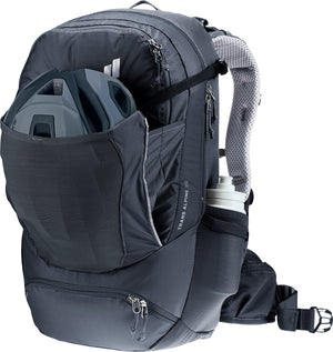 Deuter Trans Alpine 30 with a bike helmet in the front stash pocket and a bottle at the side