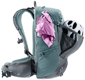 Deuter Trans Alpine Pro 28 with a helmet in the mesh front pocket and a jacket under a strap