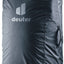 Deuter Transport Cover in Black, zipped closed around a backpack, front view