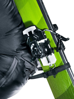 Deuter Updays 26 diagonal ski carry strap holding a ski just below its touring binding, close-up