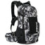 USWE Shred 16L MTB daypack in Camo/Black, front three-quarter view with mesh front pocket and hip belt