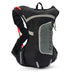 USWE Raw 4L hydration pack in Black/Grey, front three-quarter view with red drink tube
