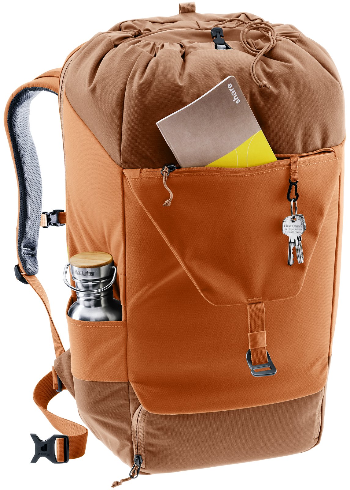 Deuter Utilion 34+5 with a notebook in the front pocket, keys on the clip and a bottle at the side