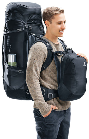 Traveller wearing the Deuter Voyager 65+10 with the day pack clipped on his chest