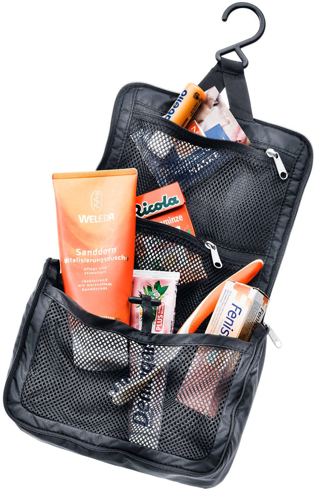 Deuter Wash Center Lite I hanging open on its hook, toiletries in the mesh pockets