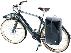 Deuter Xberg 25 clipped to the rear rack of a city bike as a pannier