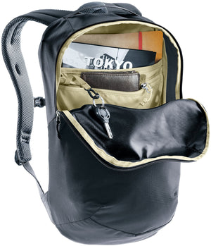 Deuter Yort 15 opened on its arch zip, showing a magazine, wallet and keys inside